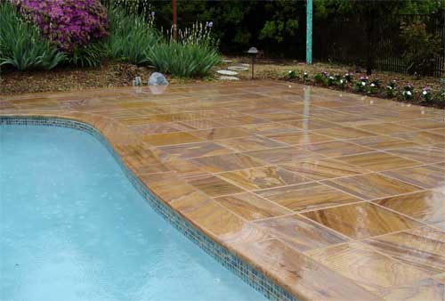 Rainbow flagstone pool with coping